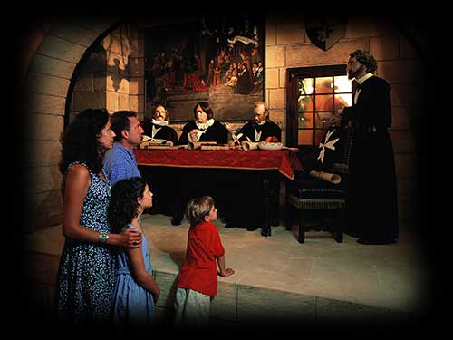 Family looking at a depiction of the grandmasters and his knights council gathering.